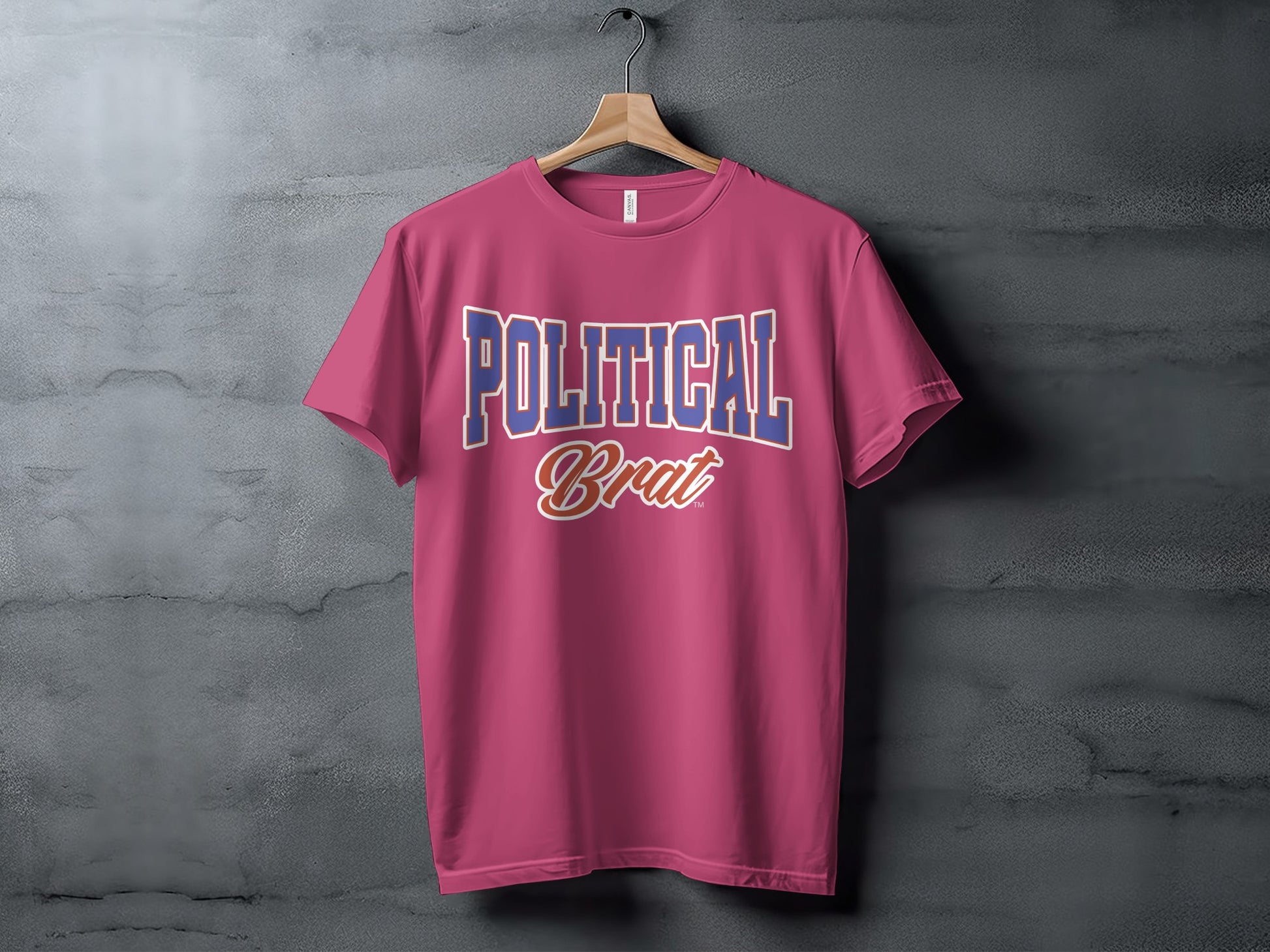Pink t-shirt with blue and white text reading "POLITICAL Brat"