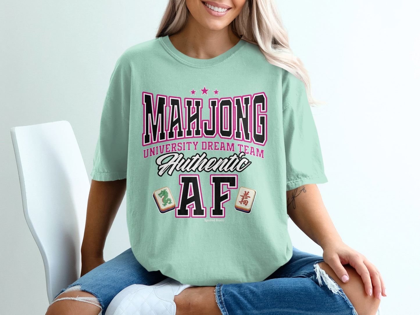 Mint t-shirt with "Mahjong University Dream Team Authentic AF" text and mahjong tiles.