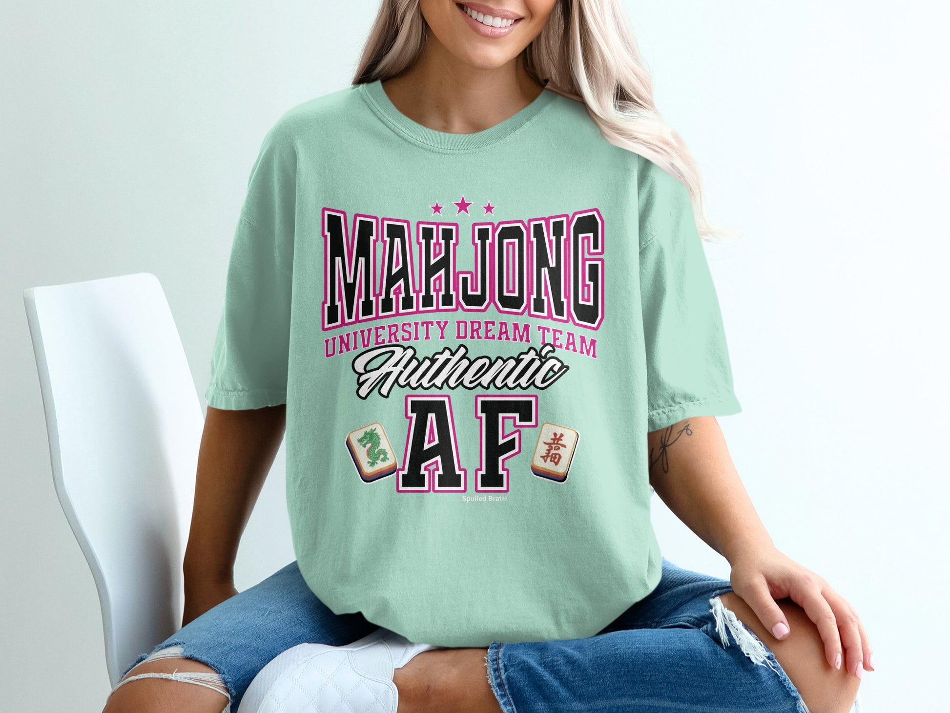 Mint t-shirt with "Mahjong University Dream Team Authentic AF" text and mahjong tiles.