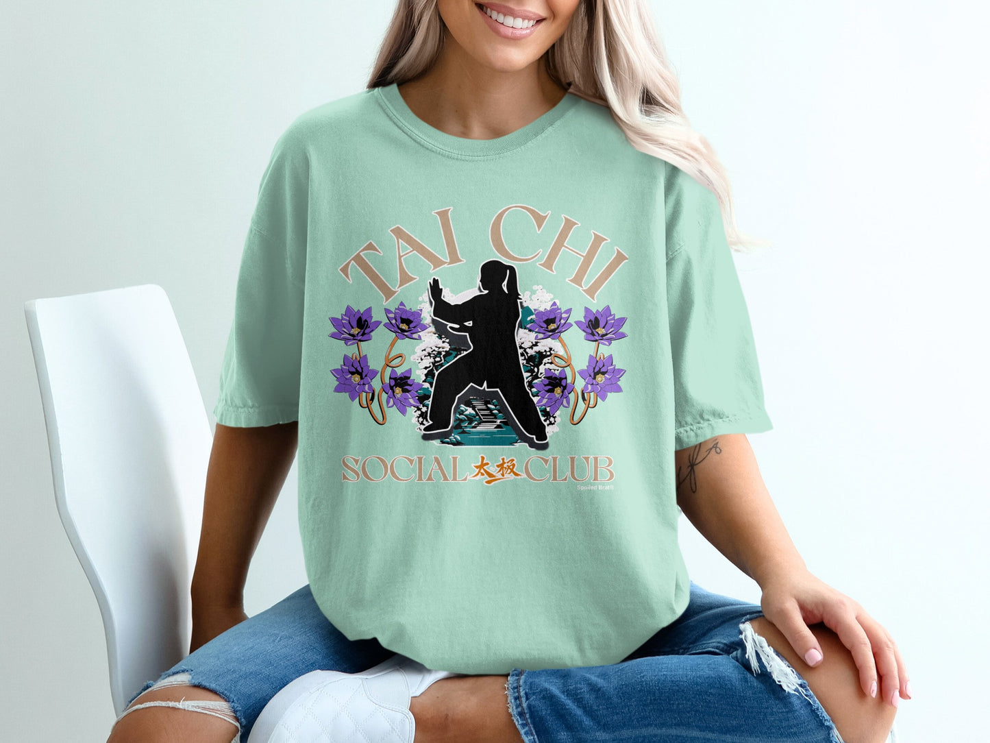 Pale green t-shirt with "Tai Chi Social Club" text and a silhouette.