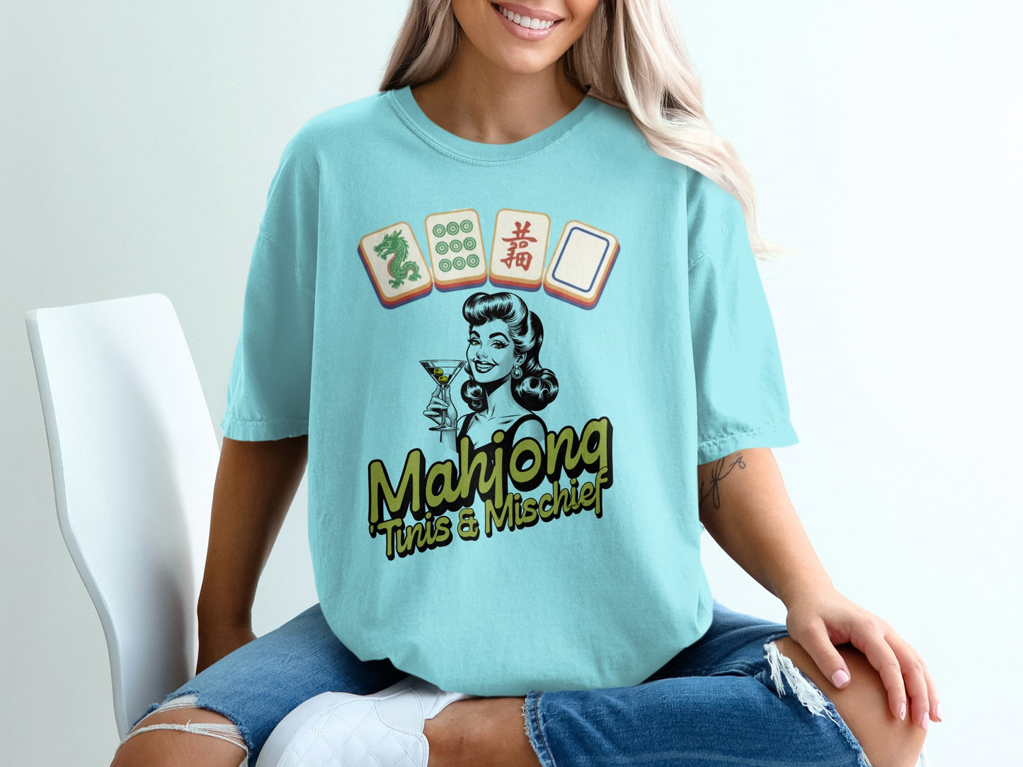 Light blue t-shirt with retro pin-up girl and mahjong tiles graphic.
