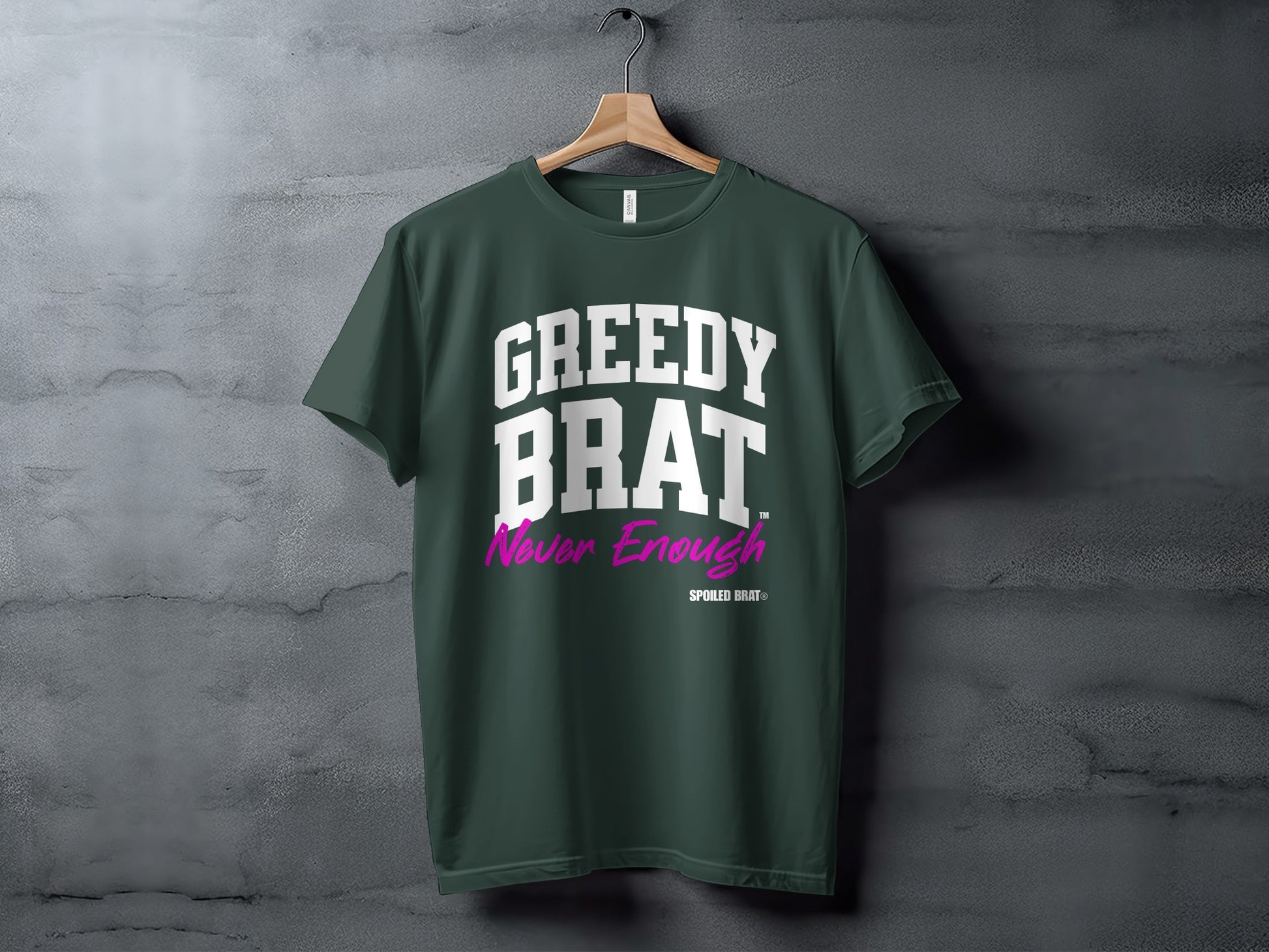 Dark green t-shirt with "GREEDY BRAT Never Enough" and "SPOILED BRAT®" text.