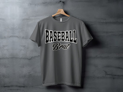 Gray t-shirt with "BASEBALL Brat" graphic on a concrete background.