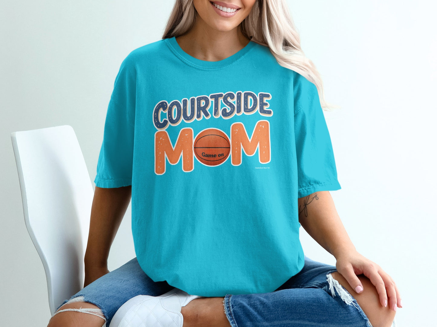Teal t-shirt with "Courtside Mom" and a basketball graphic.