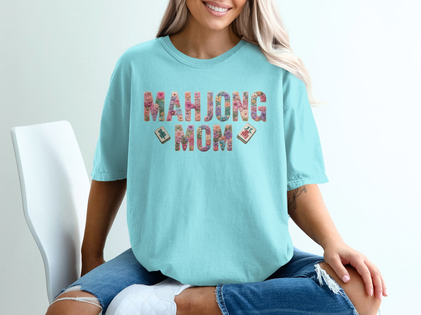 Light blue t-shirt with "Mahjong Mom" text and mahjong tiles.