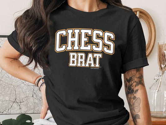 Black t-shirt with white and yellow "CHESS BRAT" text and "Another Spoiled Brat" logo.
