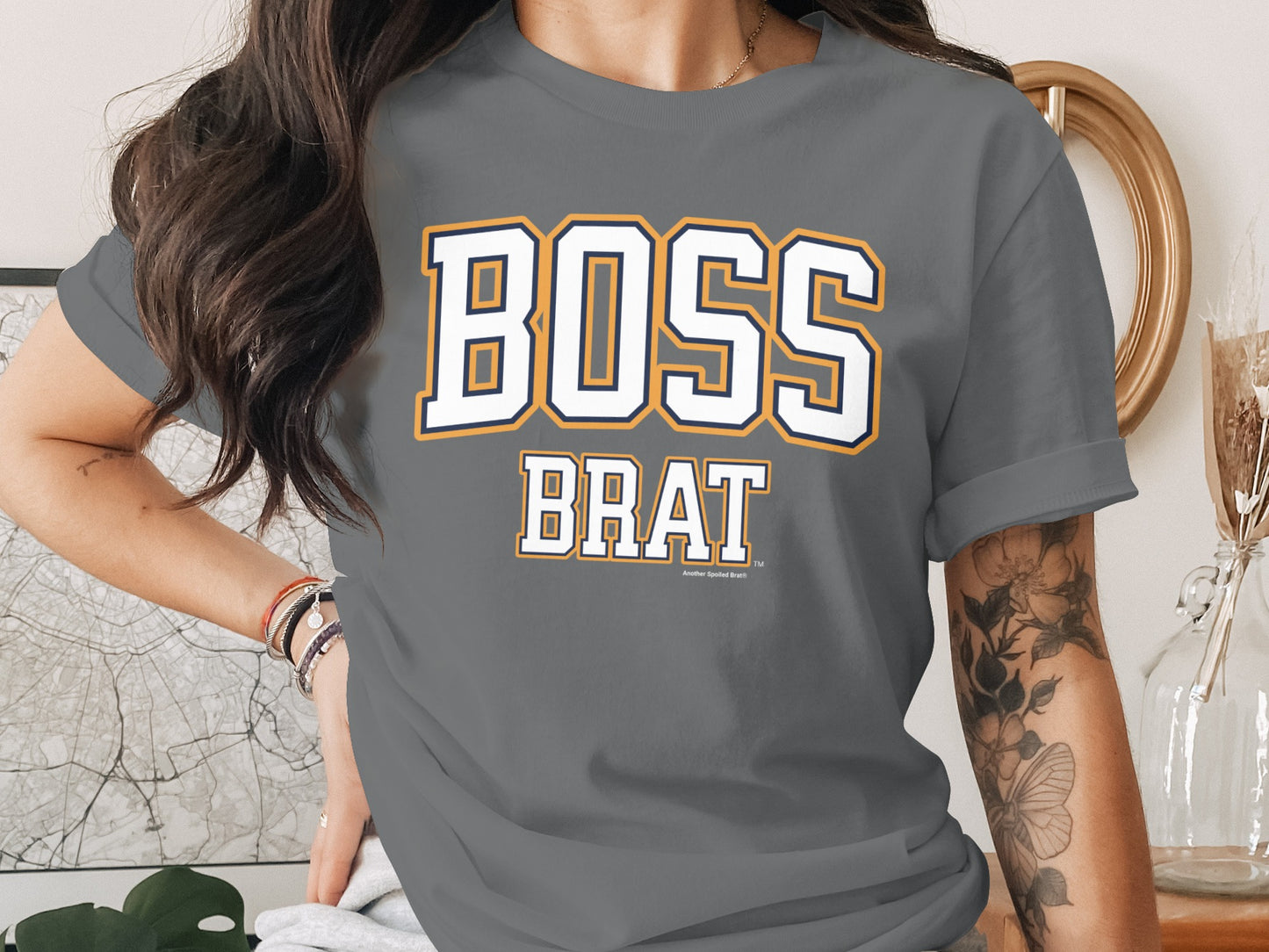 Grey t-shirt with "BOSS BRAT" text in white and navy with yellow outline.