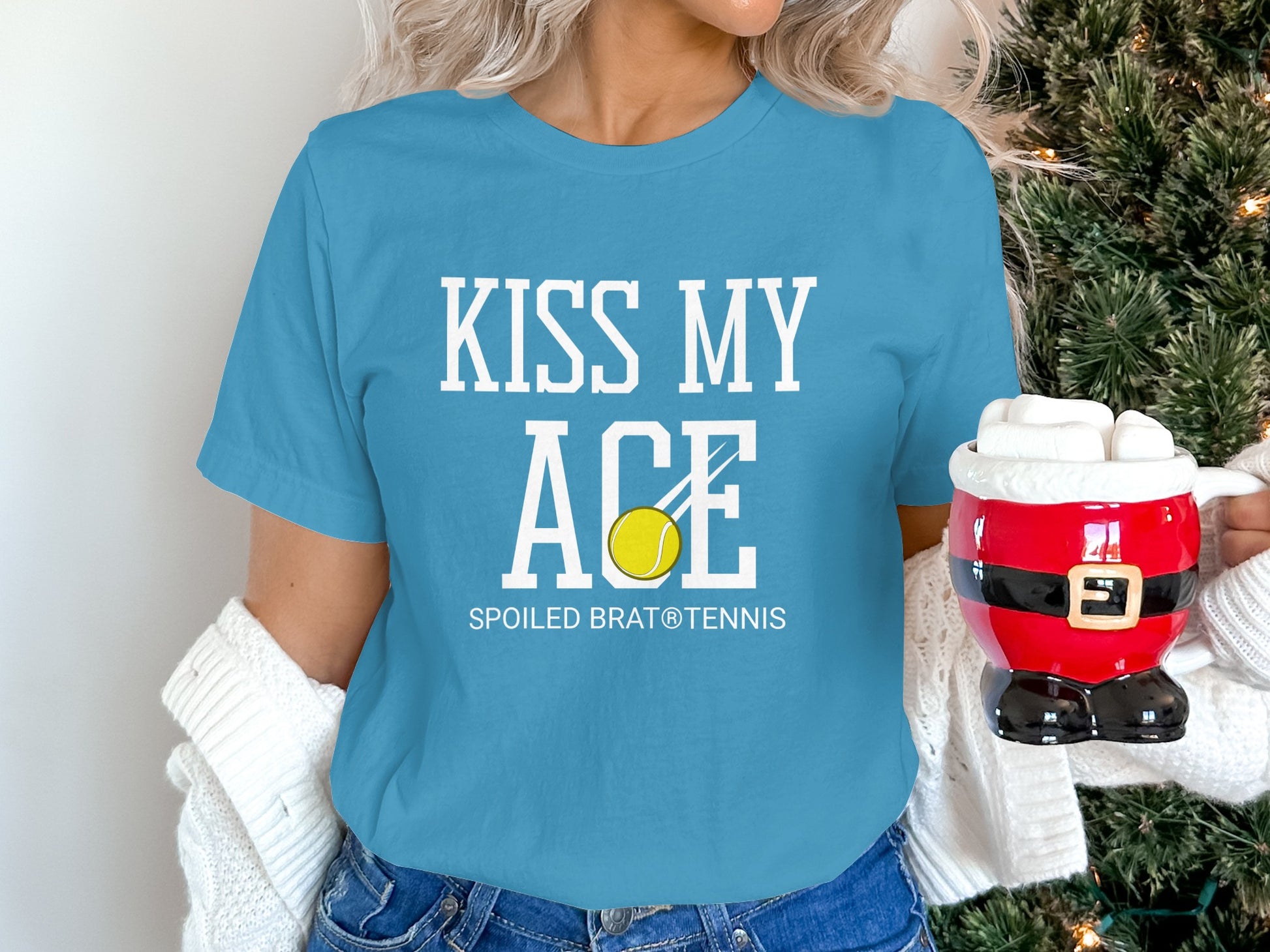 Blue t-shirt with "Kiss My Ace" and tennis ball graphic.