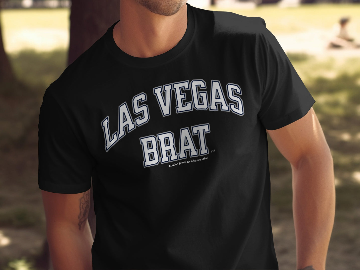 Black t-shirt with "LAS VEGAS BRAT" text in white arched font.