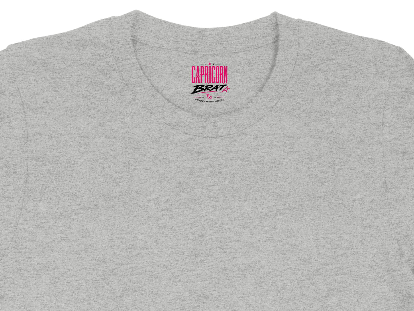 Gray t-shirt with pink "CAPRICORN BRAT" text and Capricorn symbol.