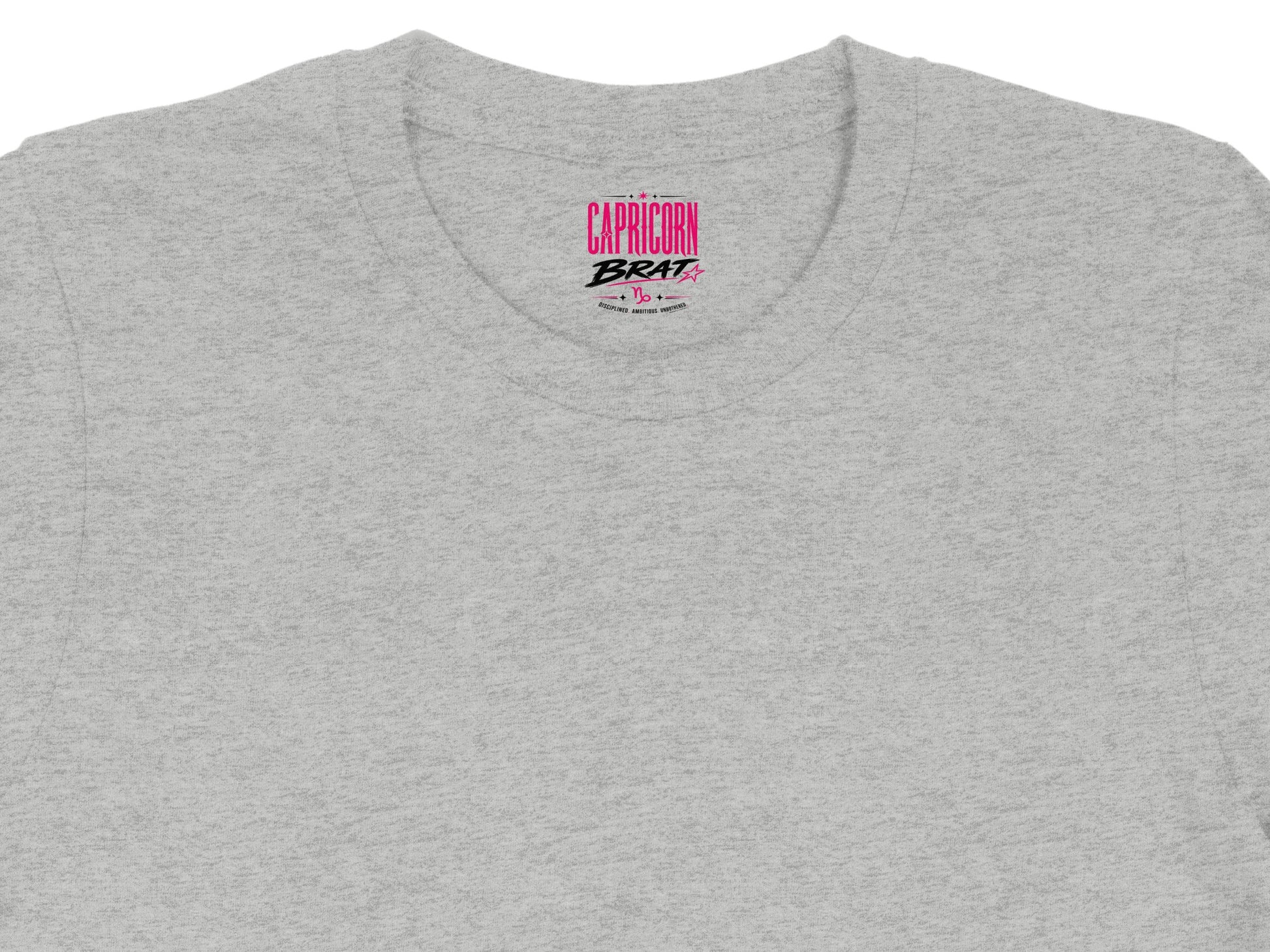 Gray t-shirt with pink "CAPRICORN BRAT" text and Capricorn symbol.