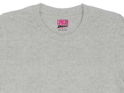 Gray t-shirt with pink "CAPRICORN BRAT" text and Capricorn symbol.