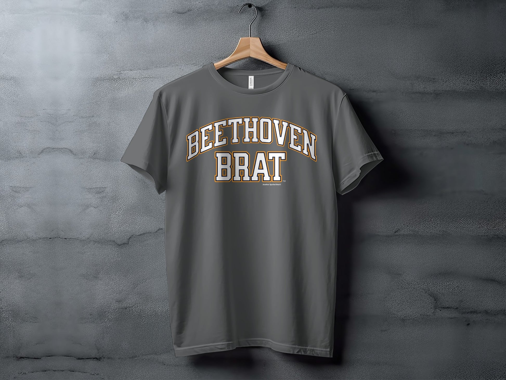 Grey t-shirt with "BEETHOVEN BRAT" text in arched white letters with gold trim.