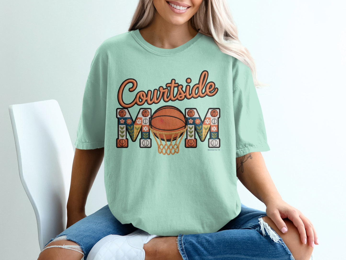 Mint t-shirt with "Courtside Mom" text and basketball hoop graphic.