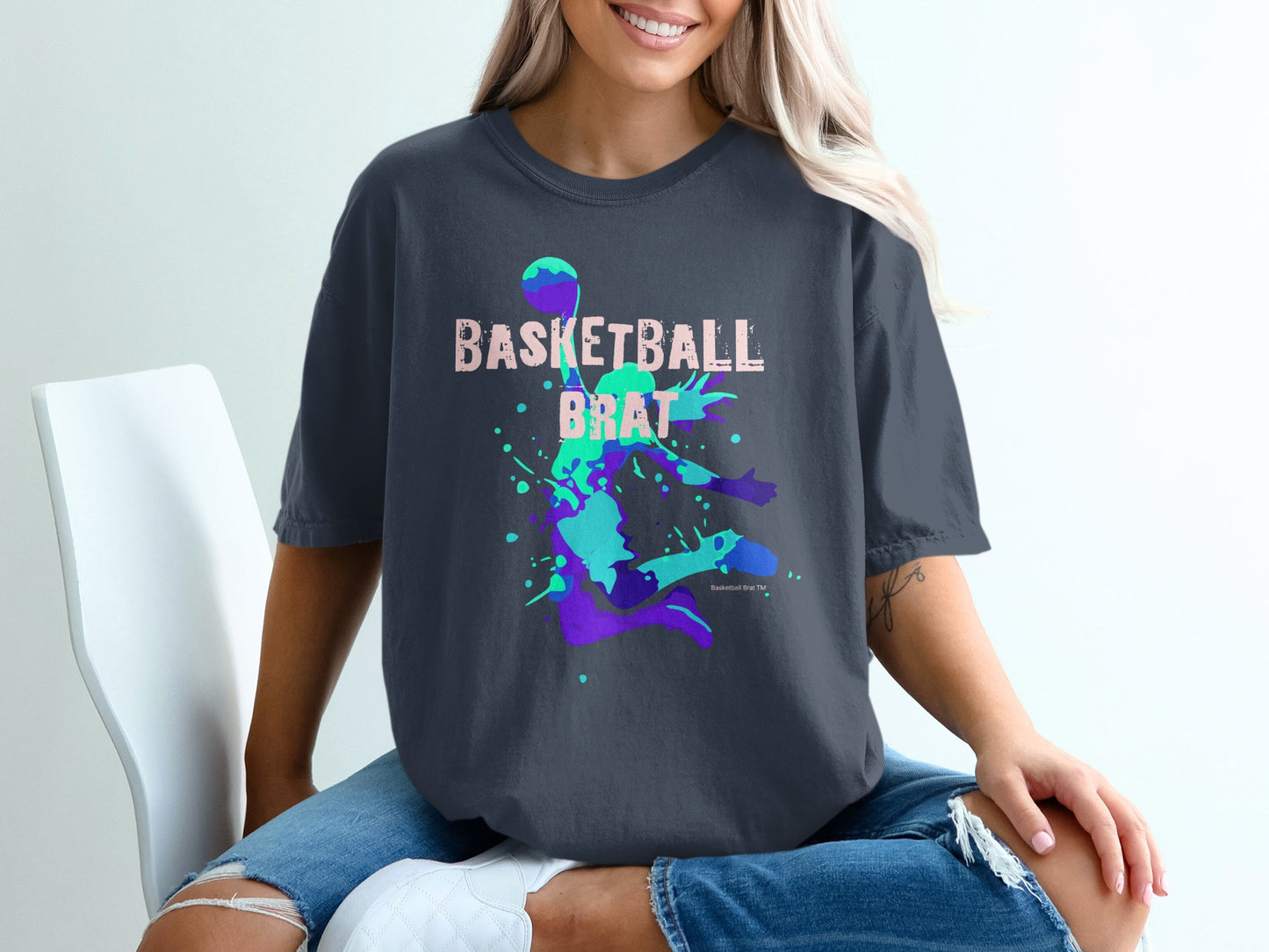 Dark t-shirt with "Basketball Brat" text and colorful splatter design.