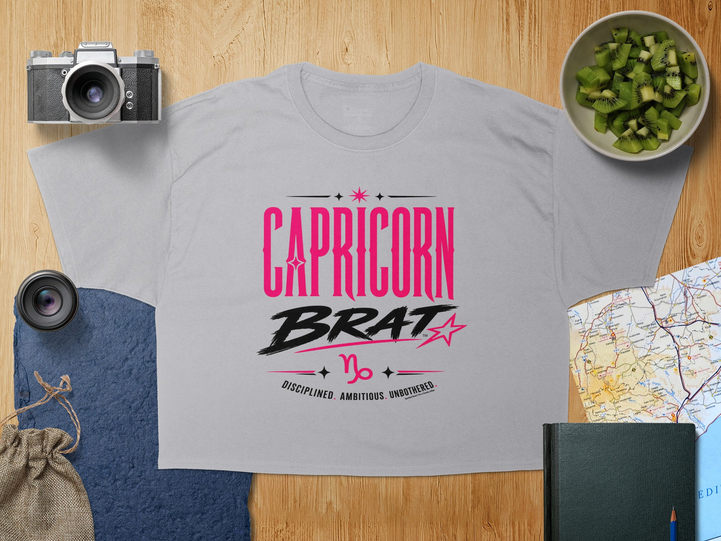Capricorn Brat t-shirt with astrological symbol and traits: Disciplined, Ambitious, Unbothered.