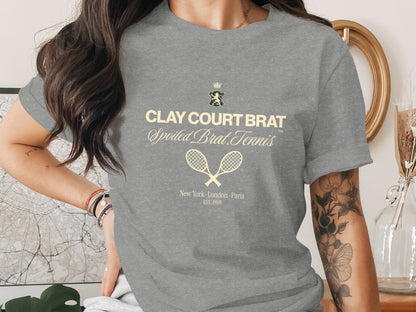 Clay Court Brat Spoiled Brat Tennis logo with crossed racquets and location text.