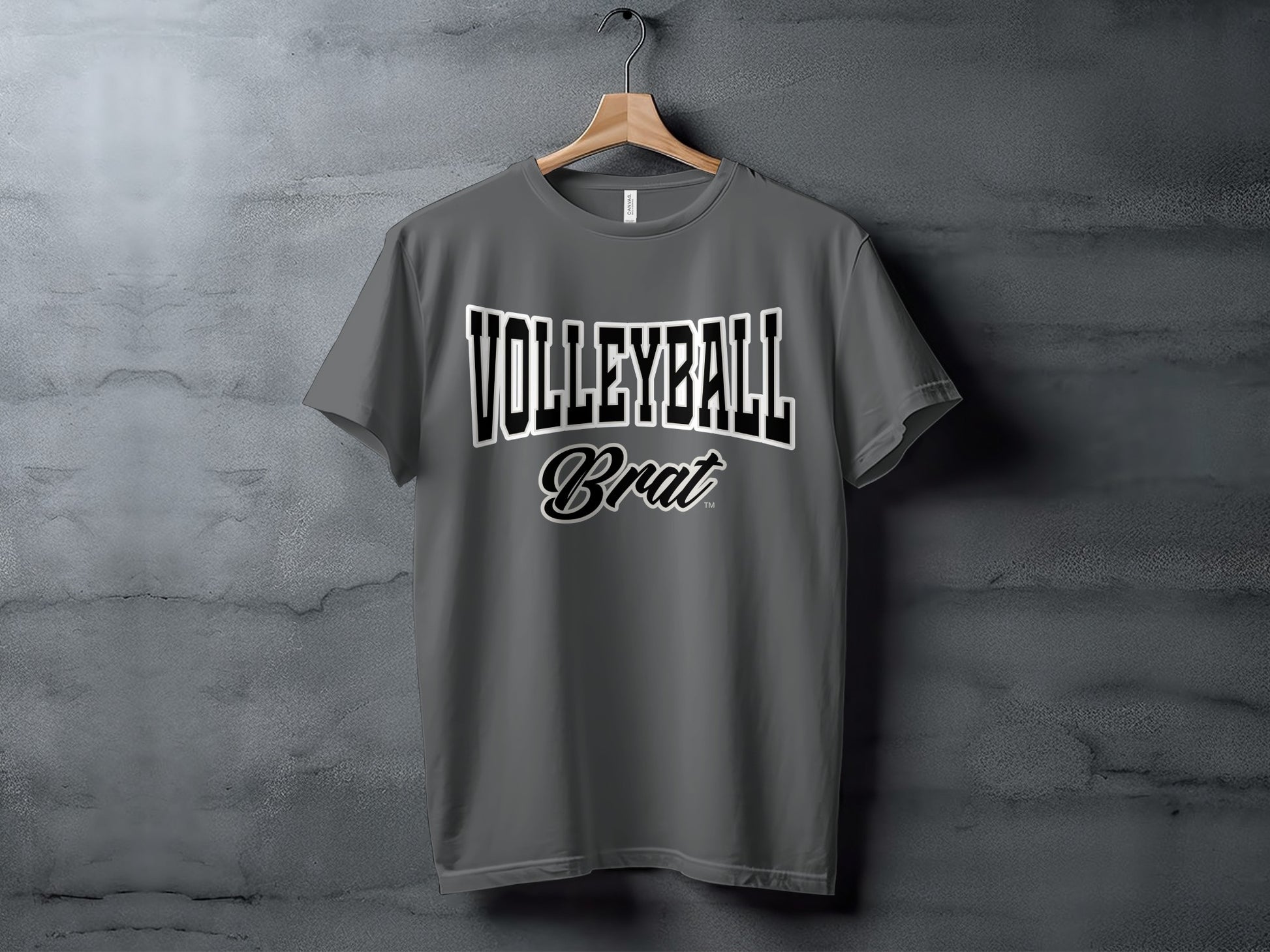 Grey t-shirt with "VOLLEYBALL Brat" text graphic on a textured background.