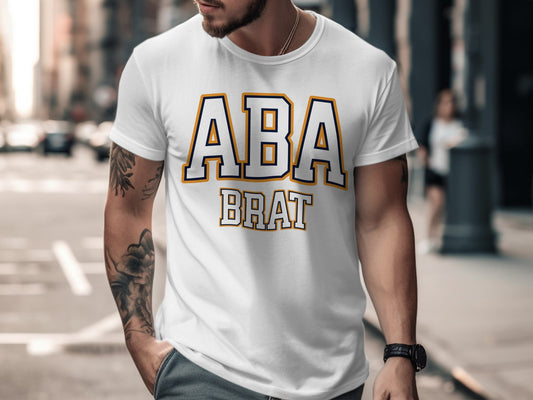 White t-shirt with navy and orange ABA BRAT text in varsity font.