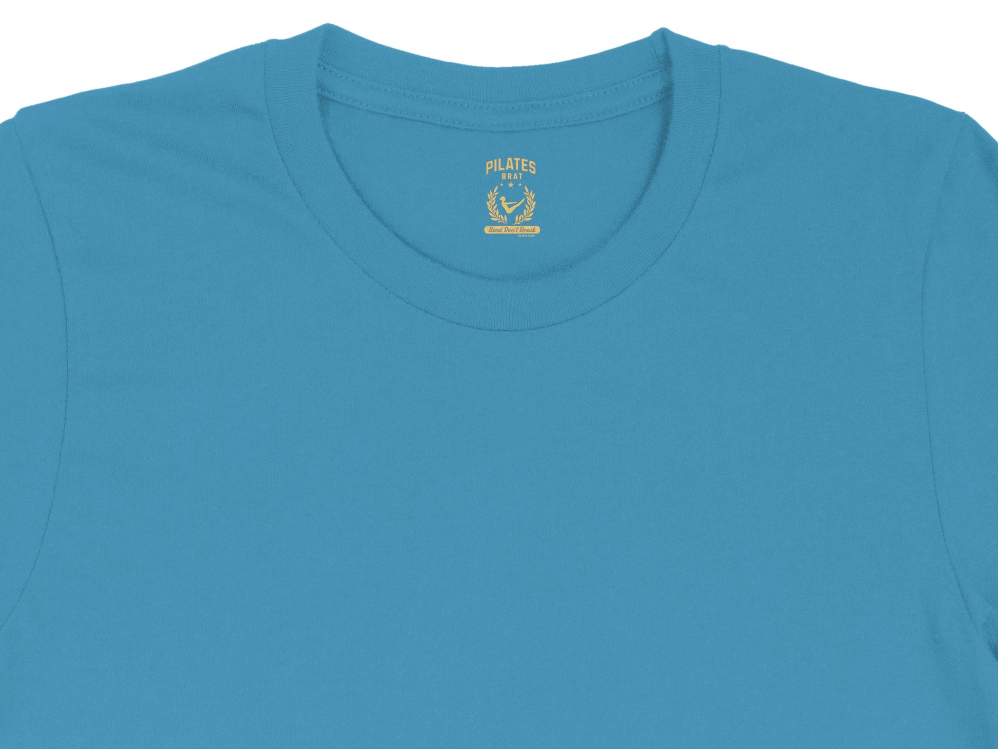 Teal t-shirt with "PILATES BRAT" text and laurel wreath logo.