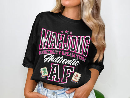 Black t-shirt with "Mahjong University Dream Team Authentic AF" in pink lettering.