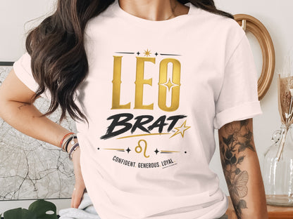 T-shirt with gold "LEO BRAT" text, Leo symbol, and traits: confident, generous, loyal.