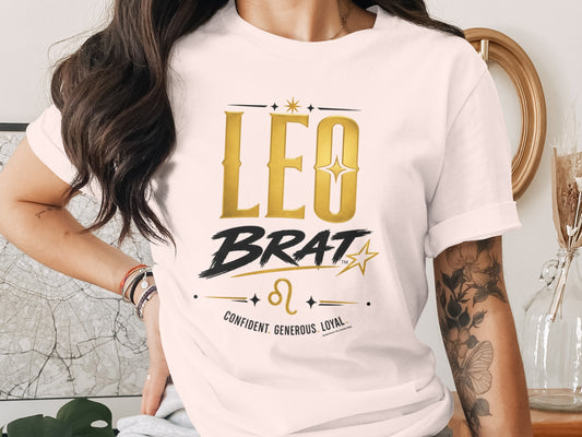 T-shirt with gold "LEO BRAT" text, Leo symbol, and traits: confident, generous, loyal.