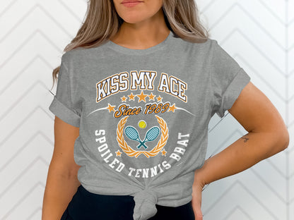 Grey t-shirt with "Kiss My Ace" and tennis graphic.