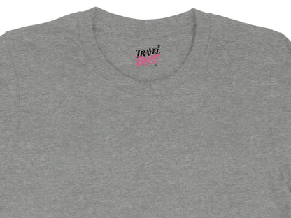 Grey t-shirt with "TRAVEL BRAT" text and airplane graphic.