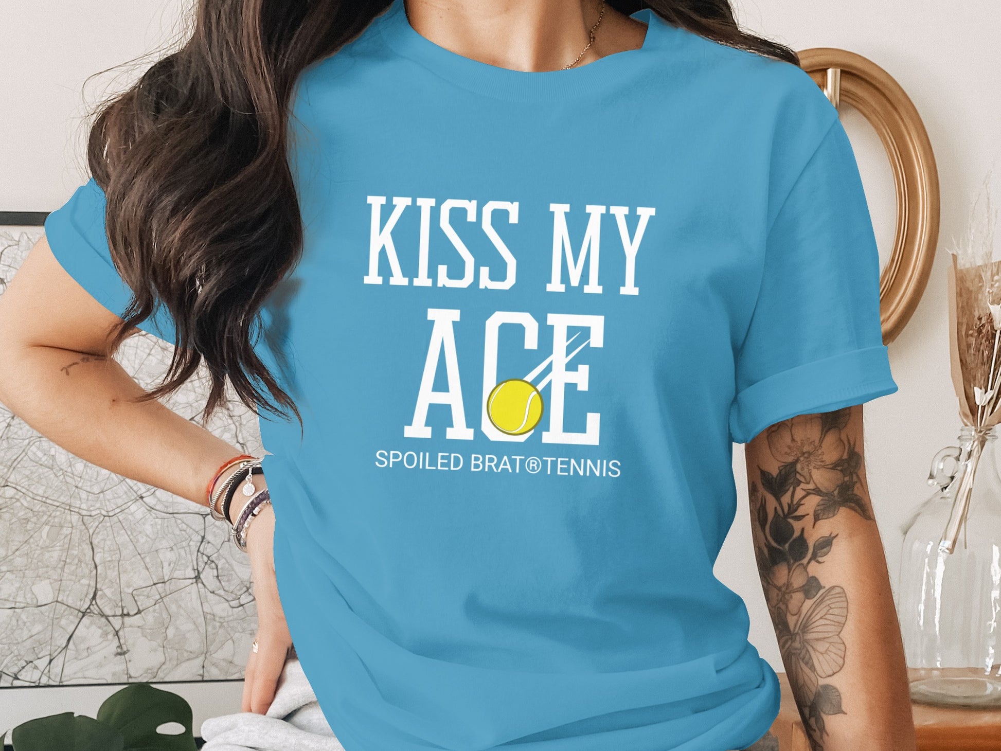 Blue t-shirt with "KISS MY ACE" and tennis ball graphic.