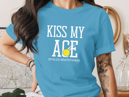 Blue t-shirt with "KISS MY ACE" and tennis ball graphic.