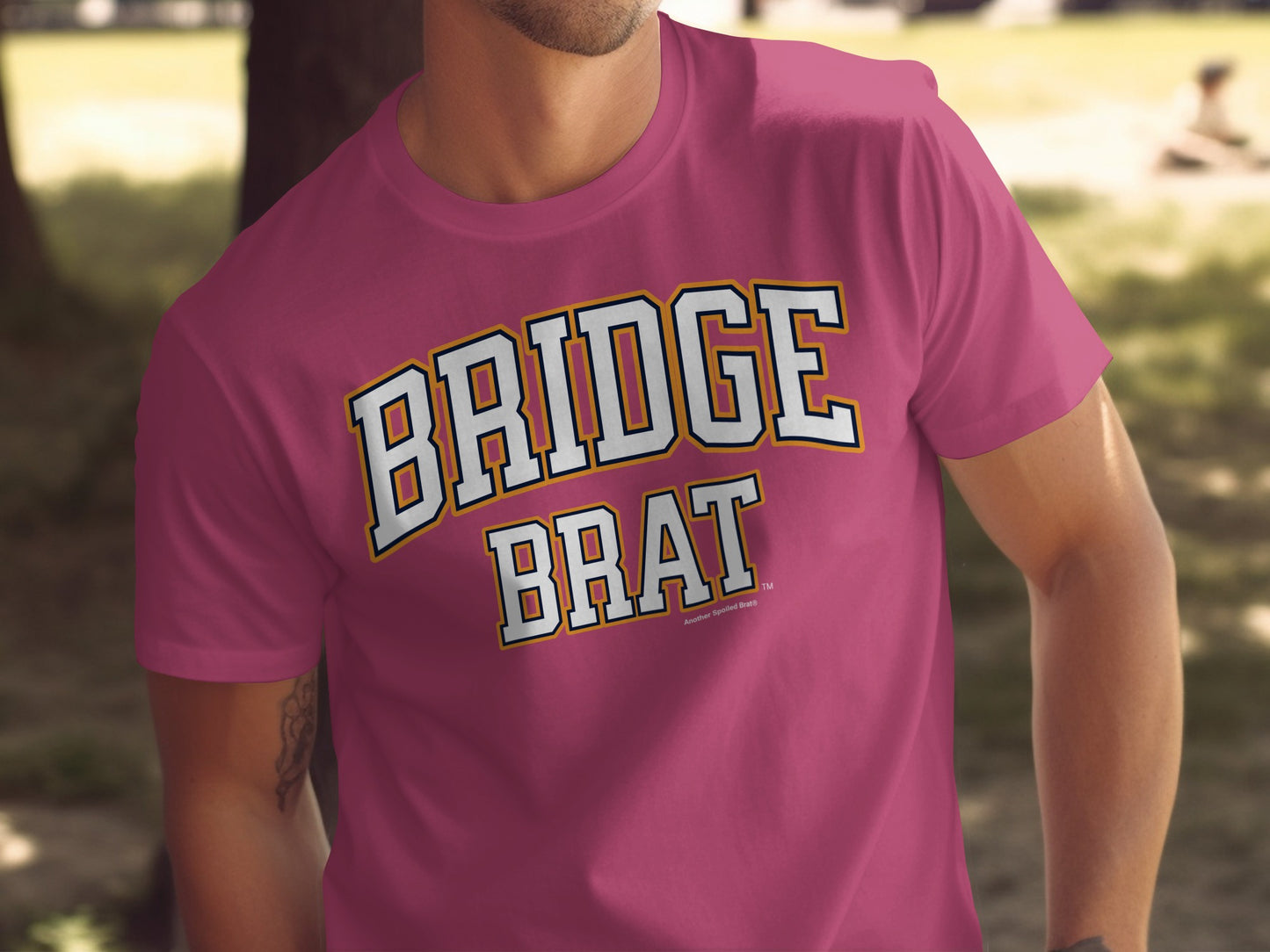 Maroon t-shirt with "BRIDGE BRAT" text in collegiate block letters.