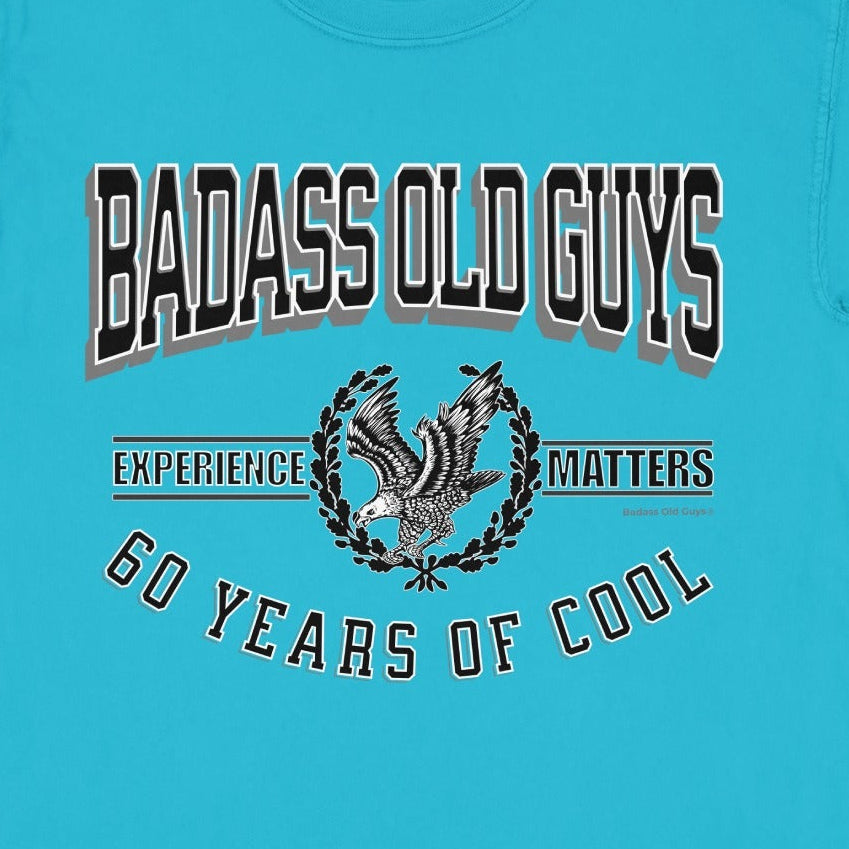 Turquoise t-shirt with "Badass Old Guys Experience 60 Years of Cool" text and eagle graphic.