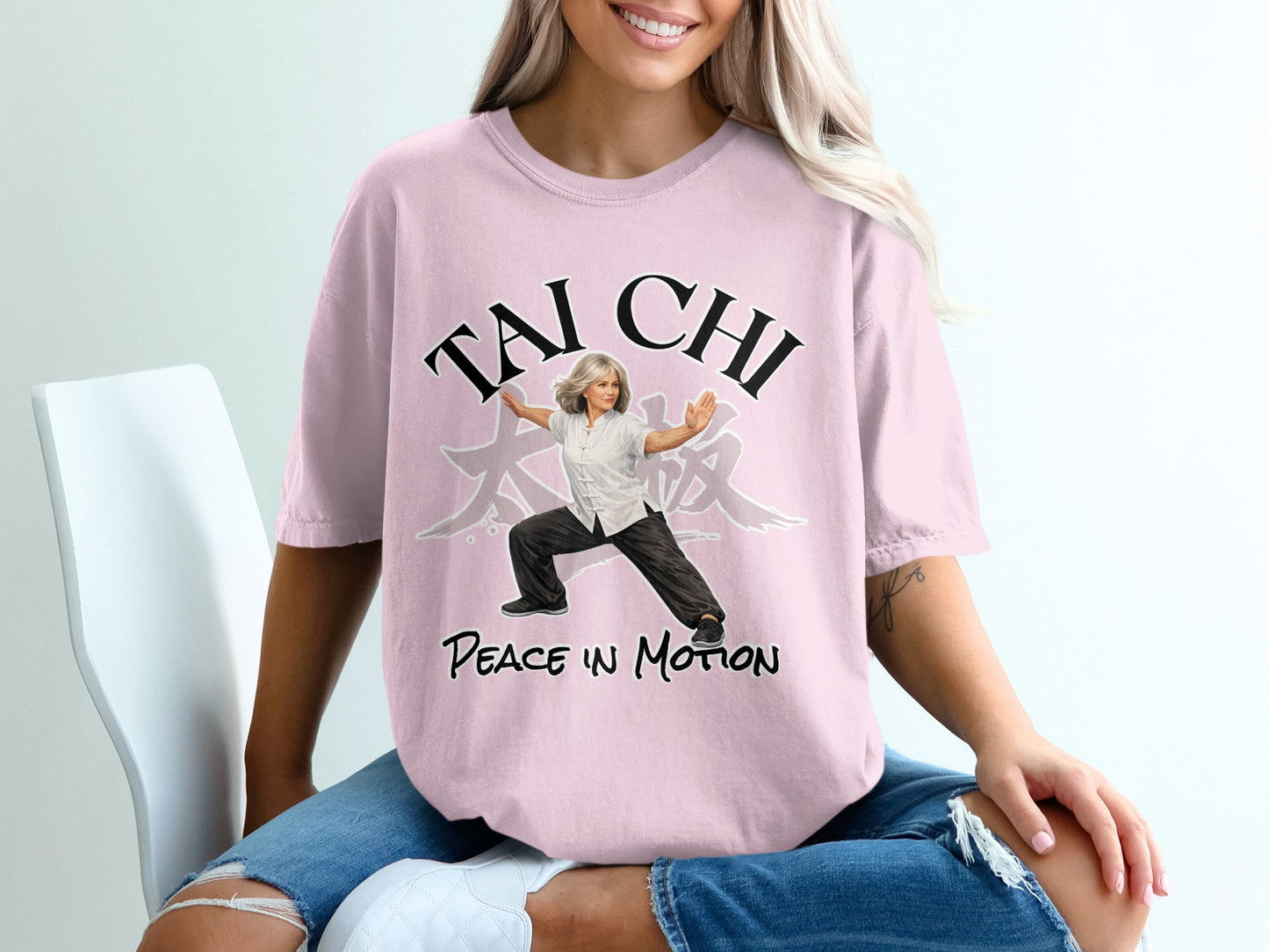 Pink t-shirt with "Tai Chi Peace In Motion" text and a woman in a martial arts pose.