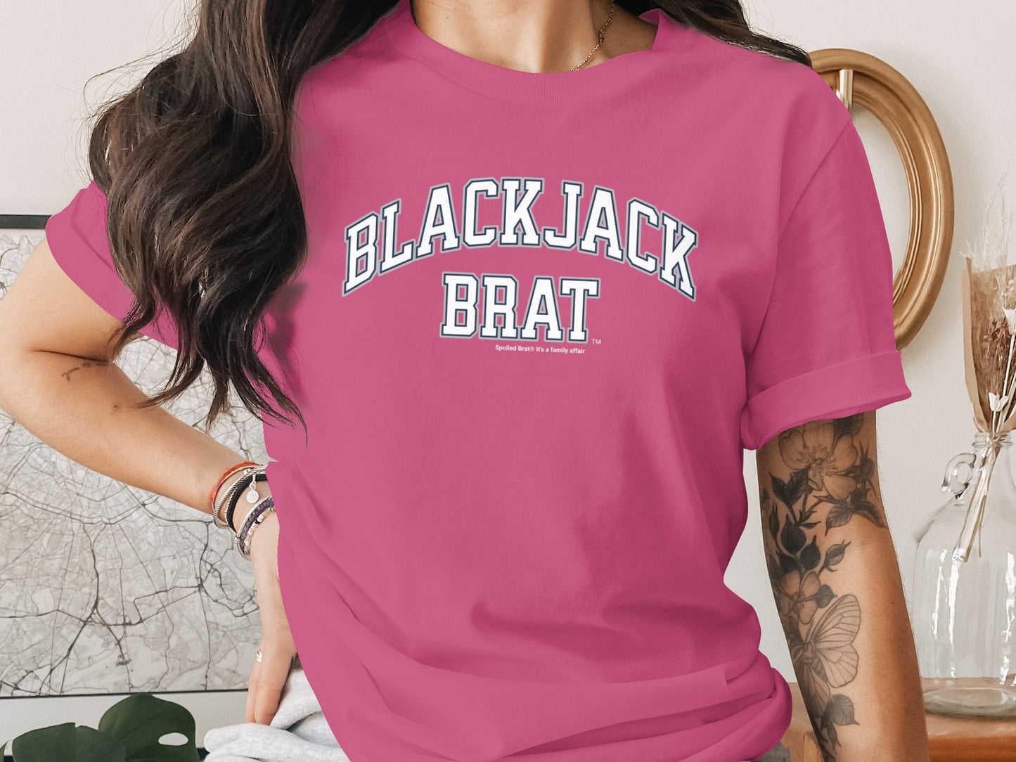 Pink t-shirt with "BLACKJACK BRAT" text and "Spoiled Brat" slogan.