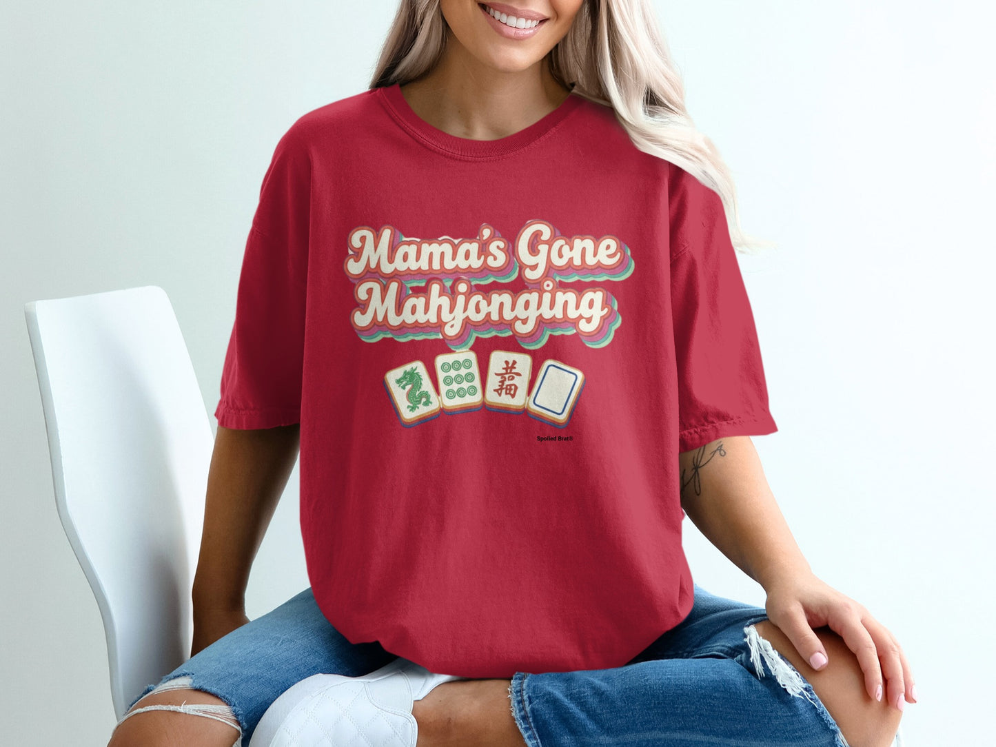 Red t-shirt with "Mama's Gone Mahjonging" text and mahjong tiles.