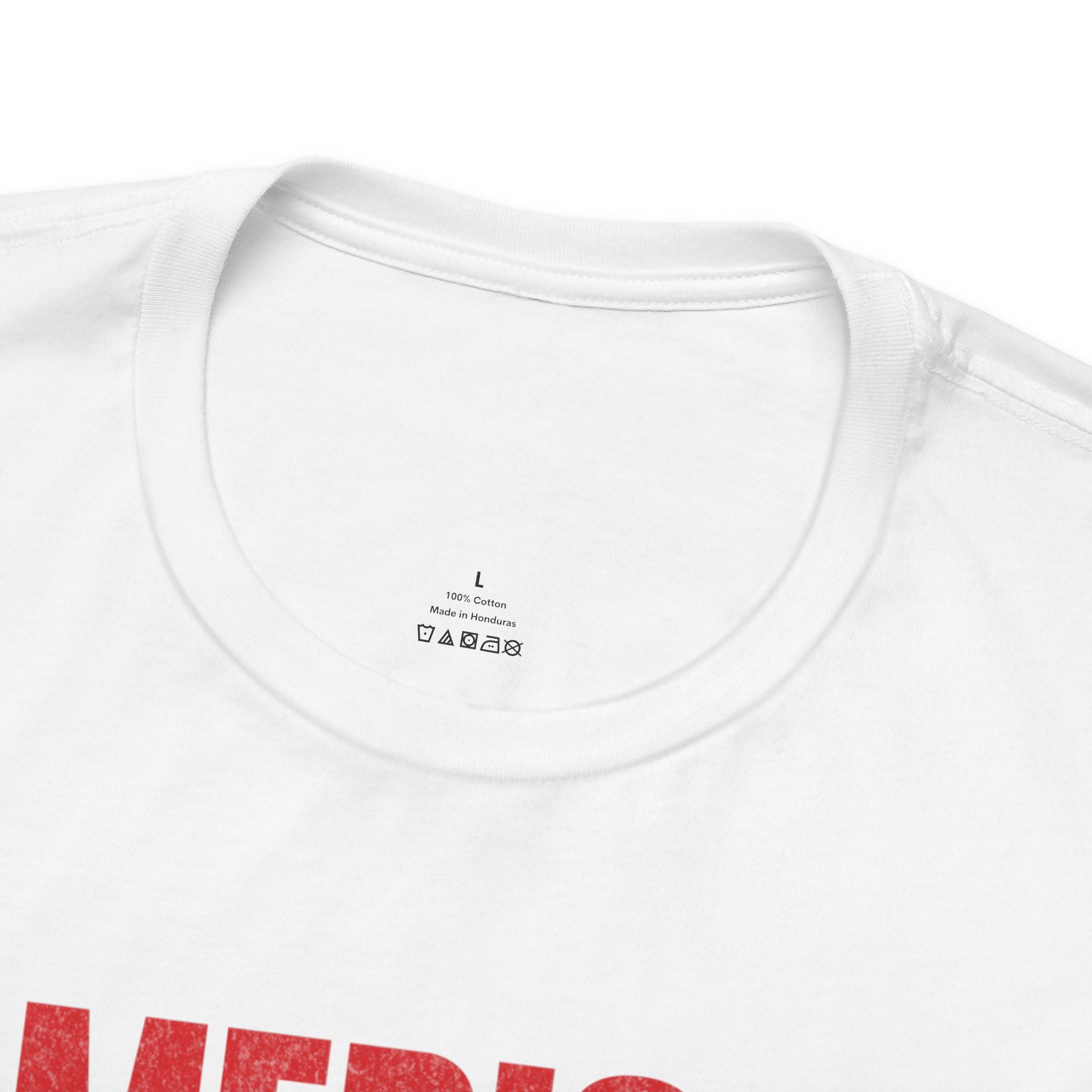 White t-shirt with size L label, 100% cotton, made in Honduras.