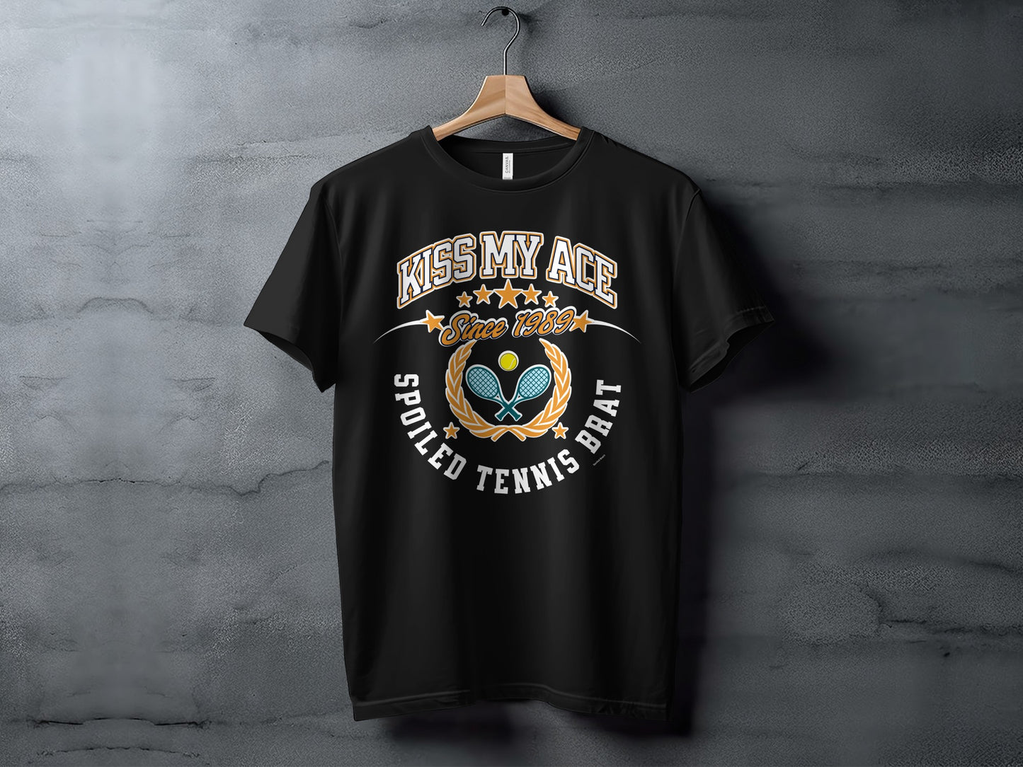 Black t-shirt with "Kiss My Ace Since 1989 Spoiled Tennis Brat" graphic.