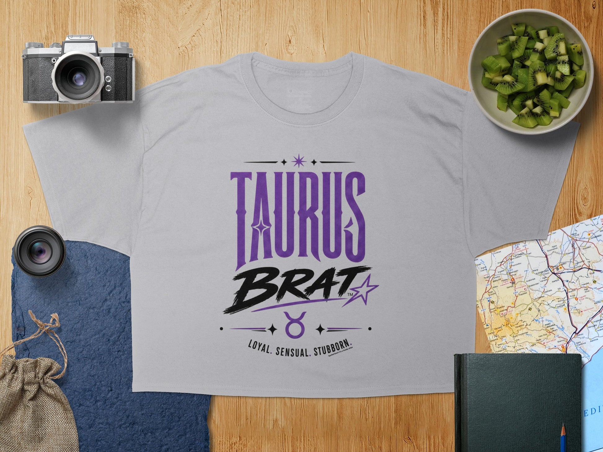 Grey t-shirt with "TAURUS BRAT LOYAL. SENSUAL. STUBBORN." text and Taurus symbol.