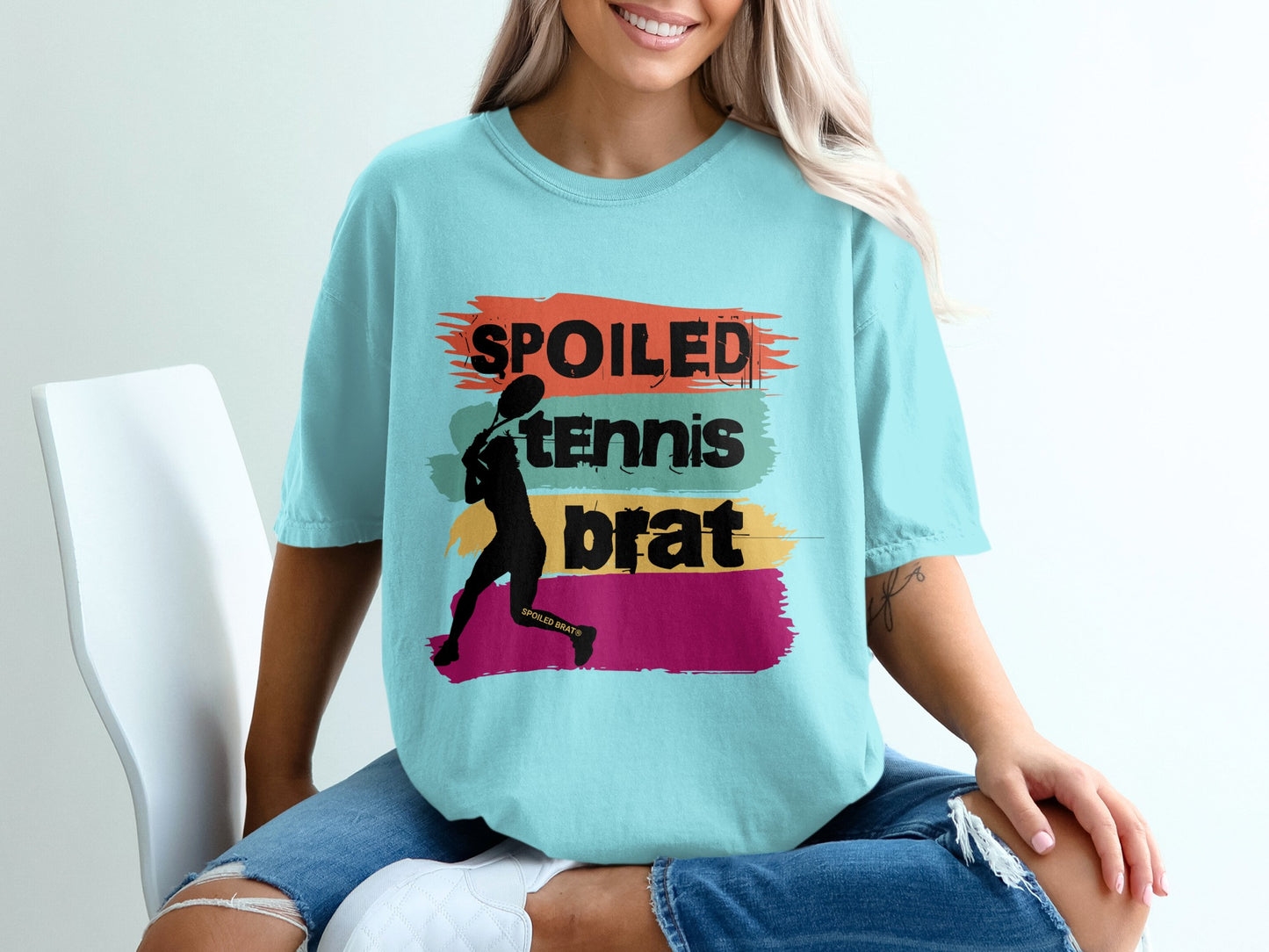 Light blue t-shirt with "SPOILED TENNIS BRAT" text and a tennis player silhouette.