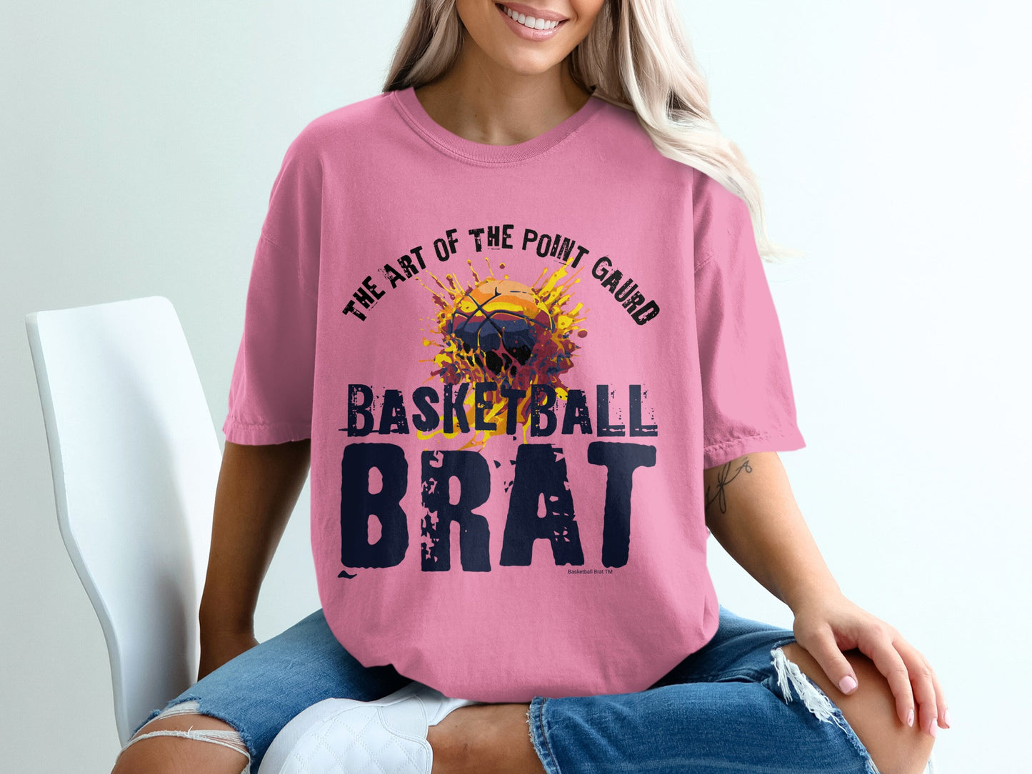Pink t-shirt with "Basketball Brat" and art design.