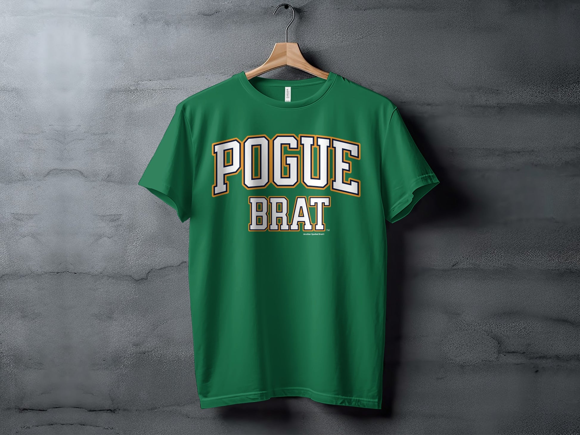 Green t-shirt with "POGUE BRAT" text in collegiate block letters.