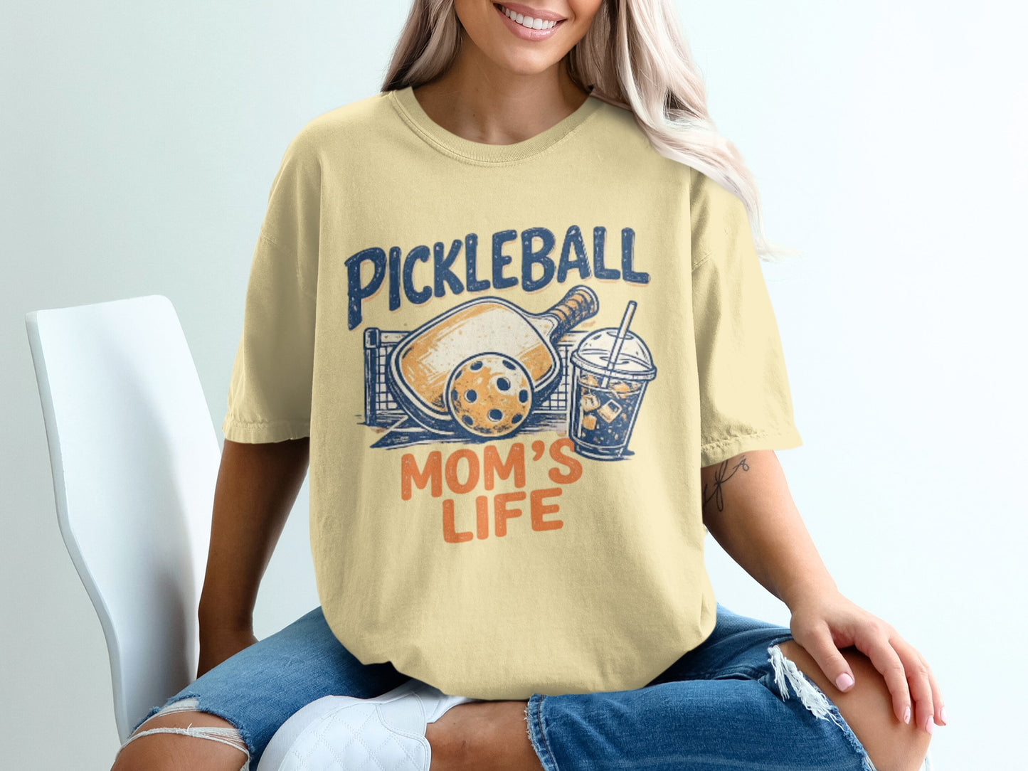 Pickleball Mom's Life graphic tee with pickleball paddle, ball, and drink.