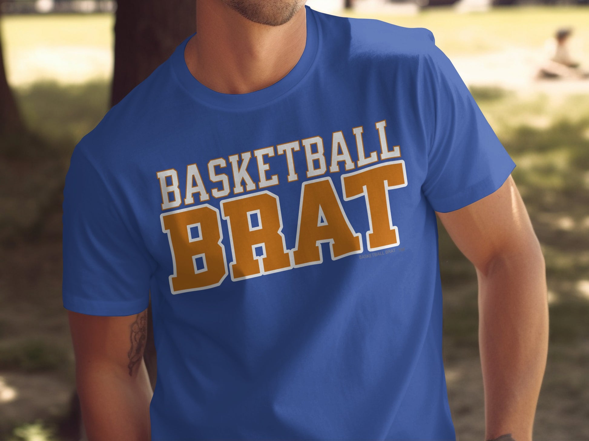 Royal blue t-shirt with "BASKETBALL BRAT" in orange and white text.
