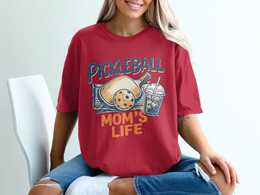 Red t-shirt with "Pickleball Mom's Life" graphic featuring paddle, ball, and drink.