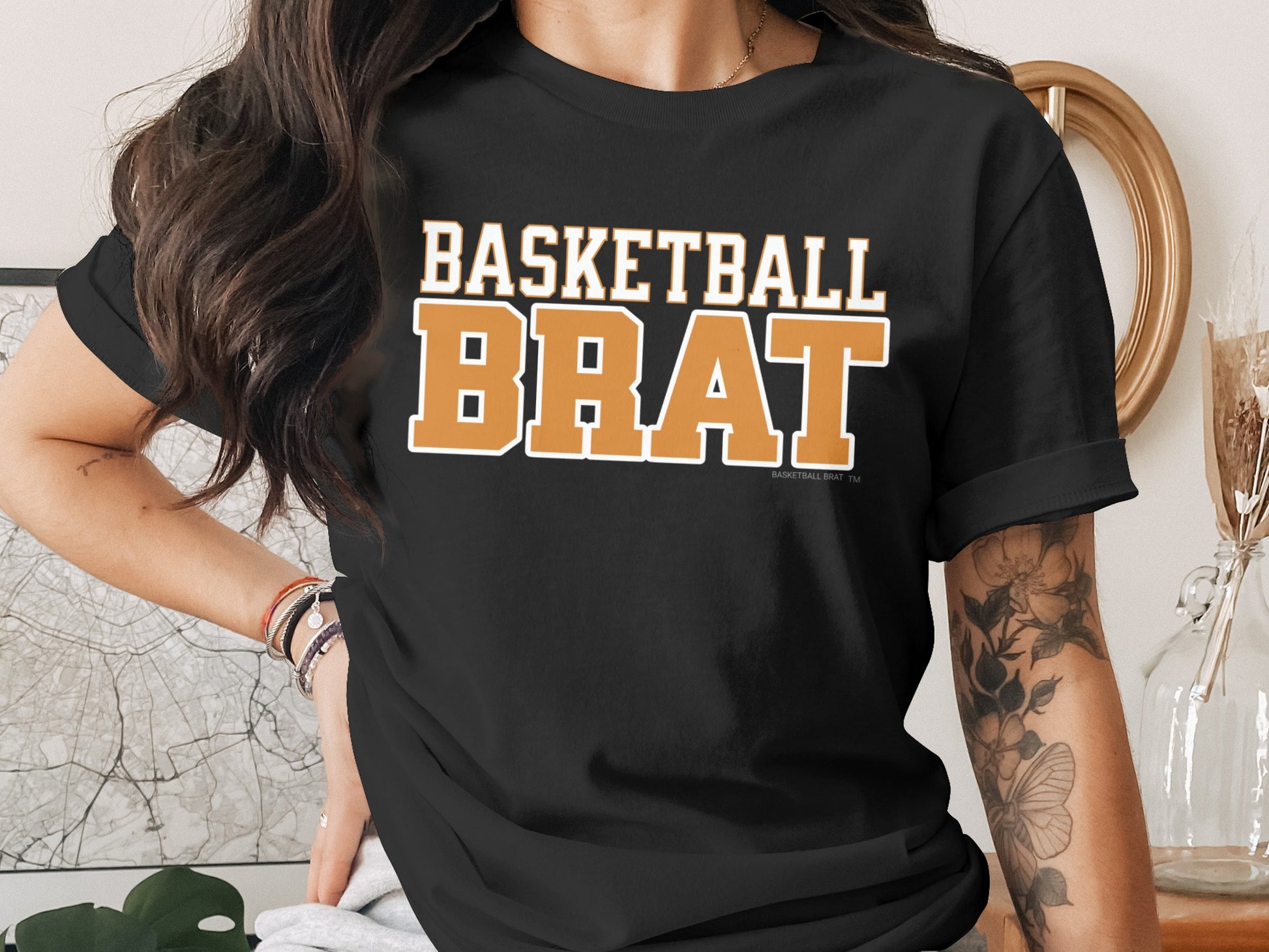 Black t-shirt with "BASKETBALL BRAT" in orange and white lettering.