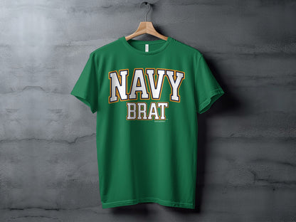 Green t-shirt with white and gold text reading "NAVY BRAT" and "Another Spoiled Brat"