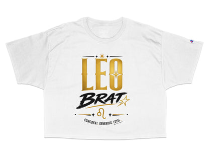 White crop top with "LEO BRAT" in gold and black, Leo symbol, and "CONFIDENT. GENEROUS. LOYAL."