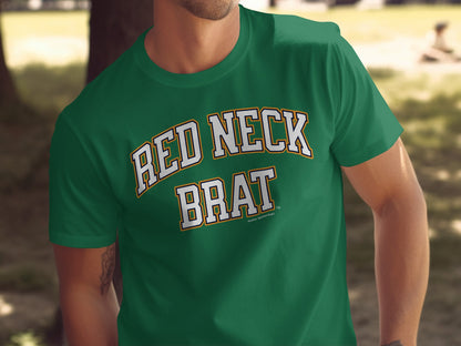Green t-shirt with "RED NECK BRAT" in white and gold collegiate lettering.