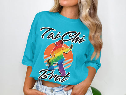 Turquoise t-shirt with "Tai Chi Brat" and rainbow silhouette.
